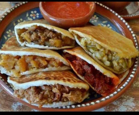 Thick handmade corn cakes stuffed with your choice of savory filling