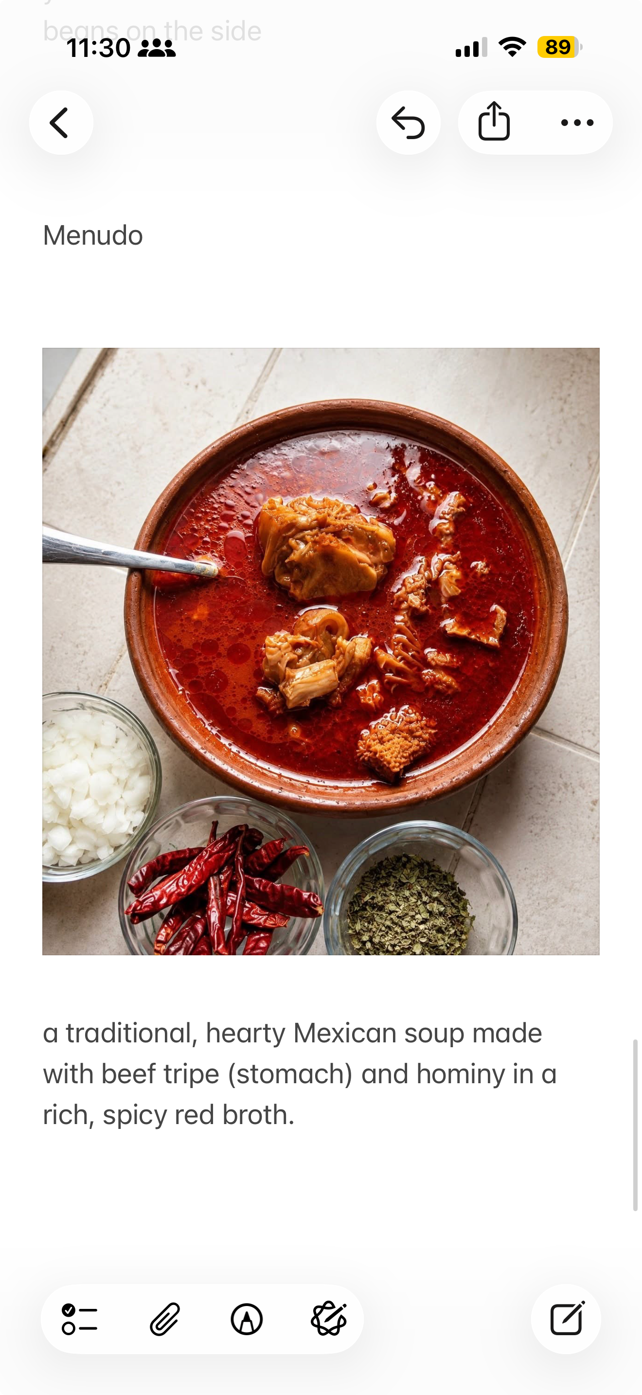 Traditional Mexican menudo — beef tripe and hominy in a rich spicy red broth